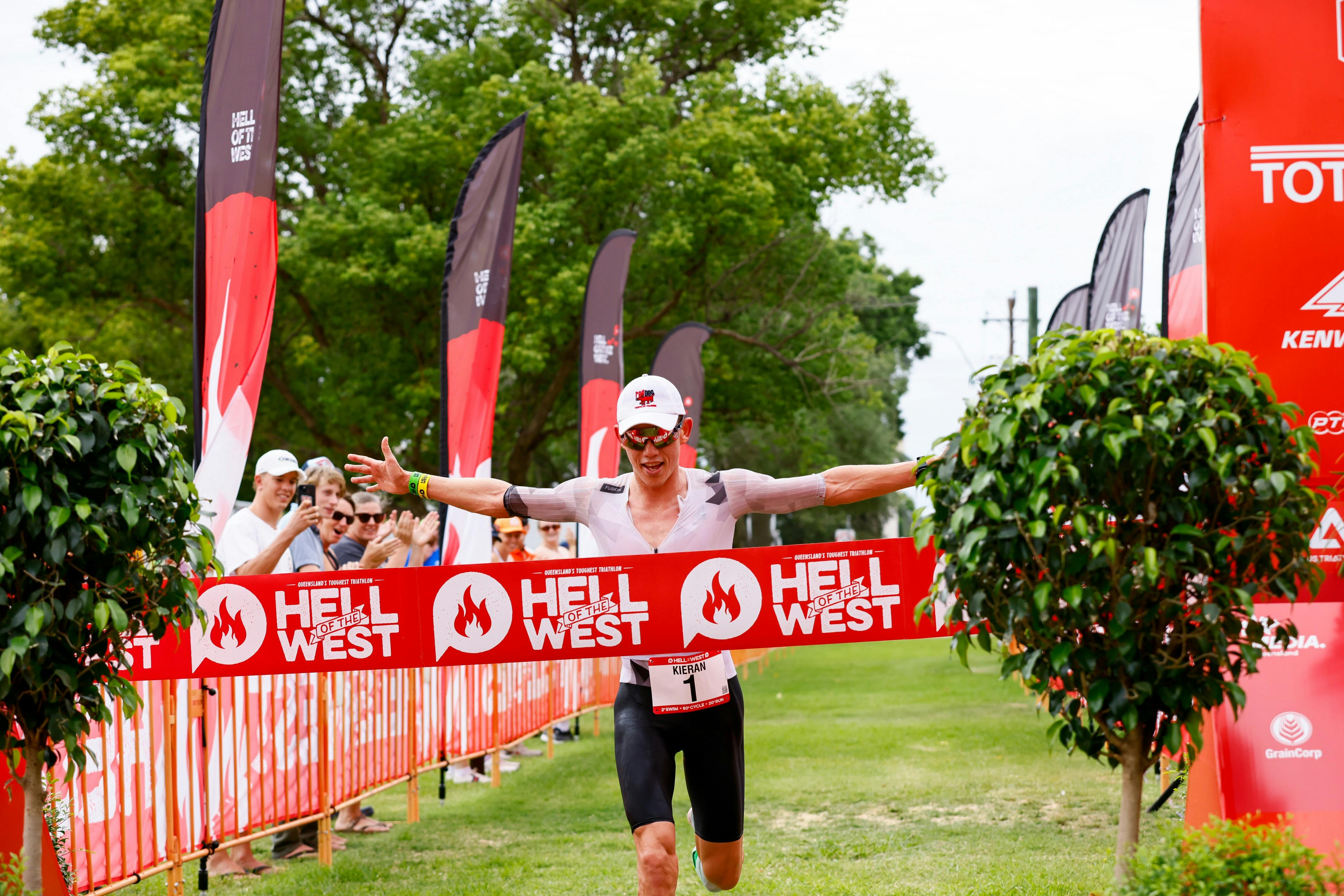Male winner Kieran Storch crossing the line