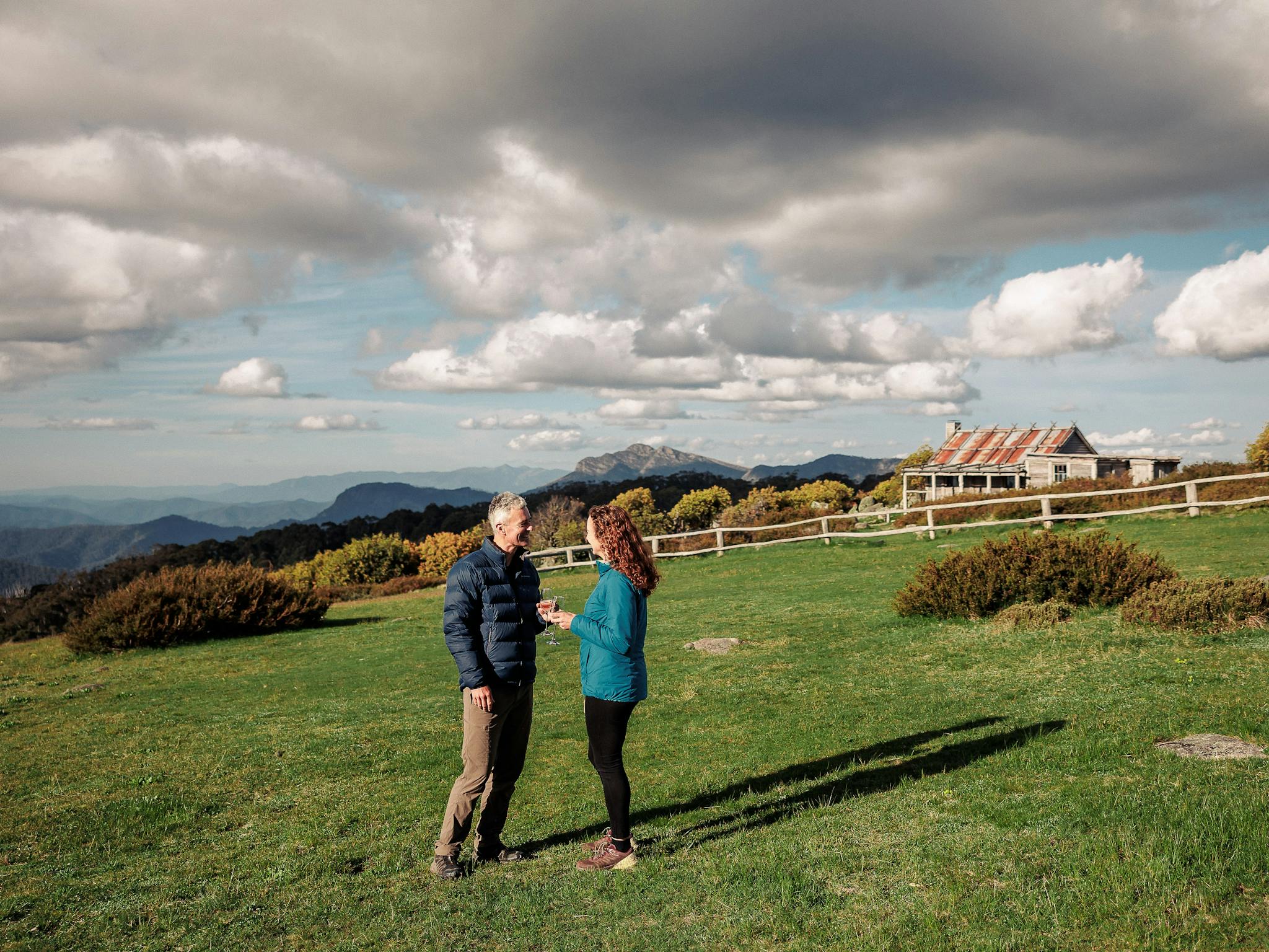 A couple enjoying a beverage and some private time in the surrounds of Craig's Hut.