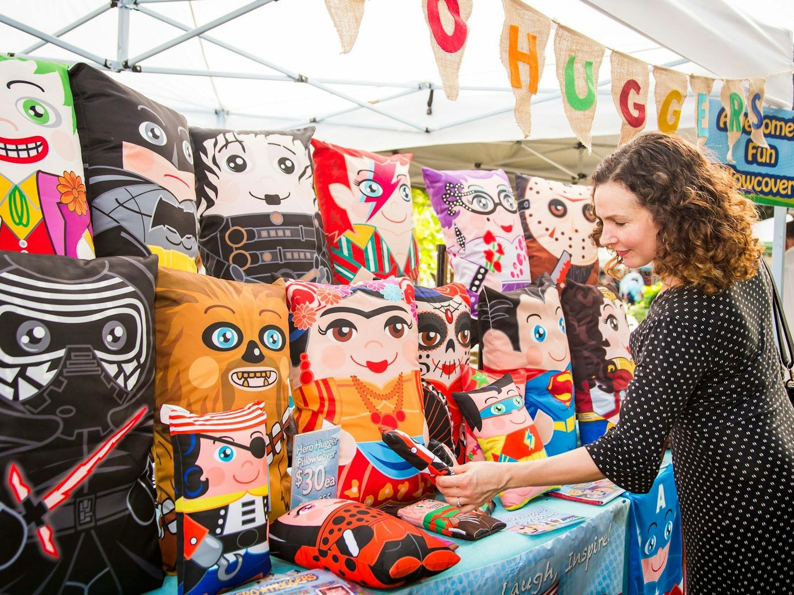 Woman browsing homewares at Balmain Markets