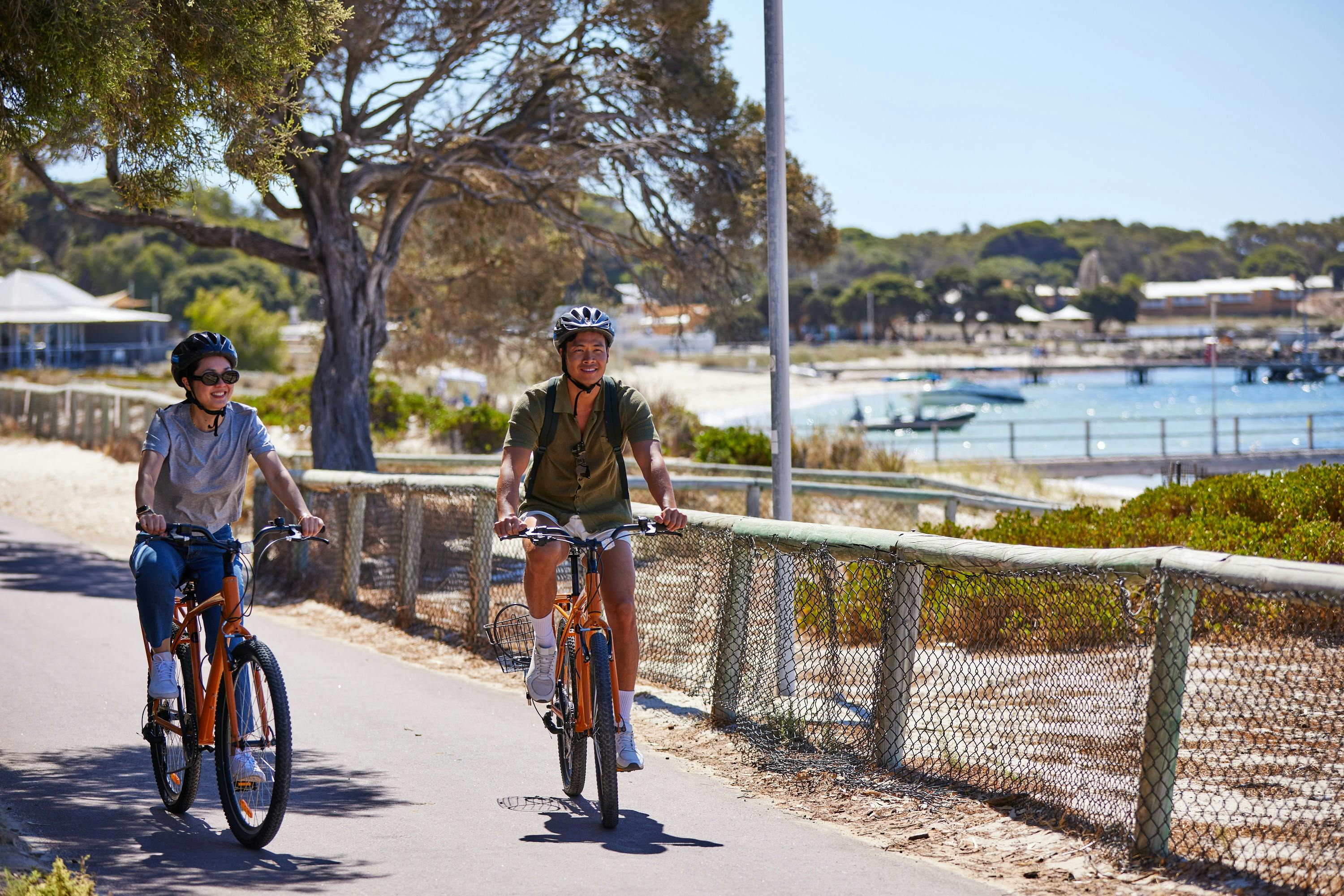 Couple riding on Pedal & Flipper Hire Bikes