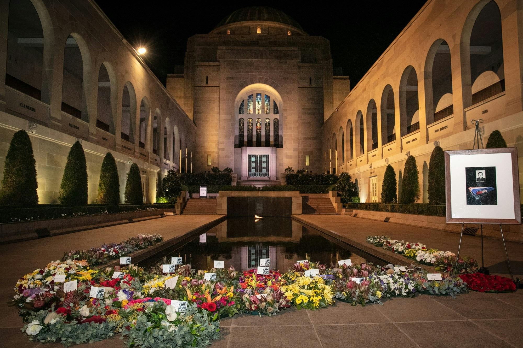 Wreaths and the pool of reflection in the Commemorative Area at the Australian War Memorial
