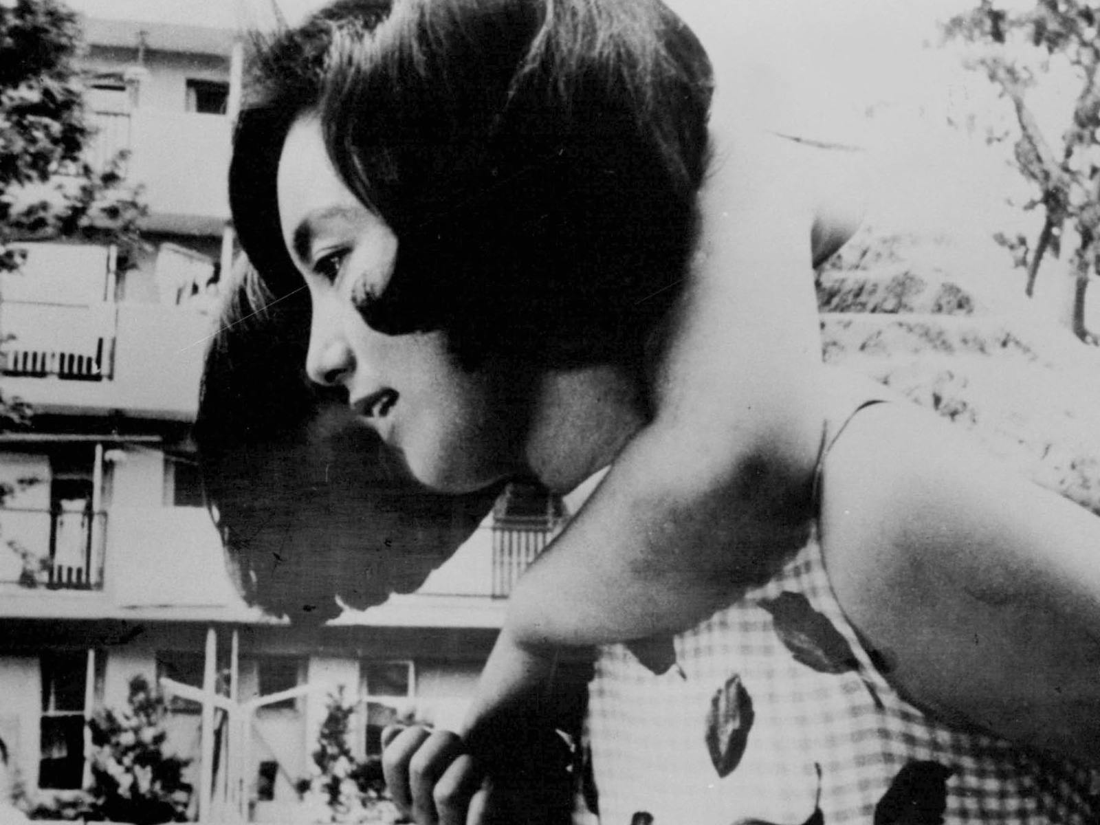 Black and white image of a woman holding a child