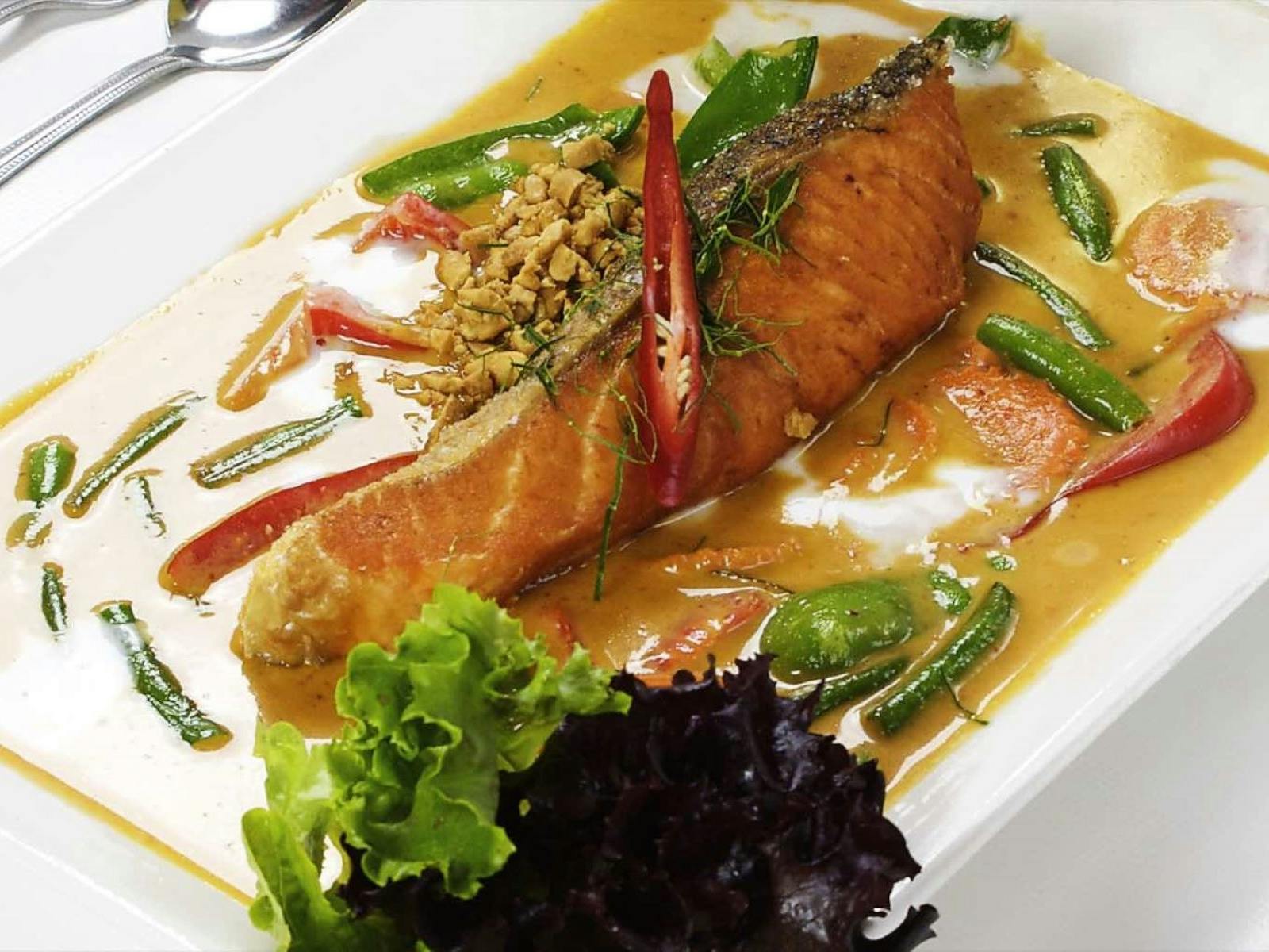 An Image of cooked and deshelled lobster in a curry sauce Lobster