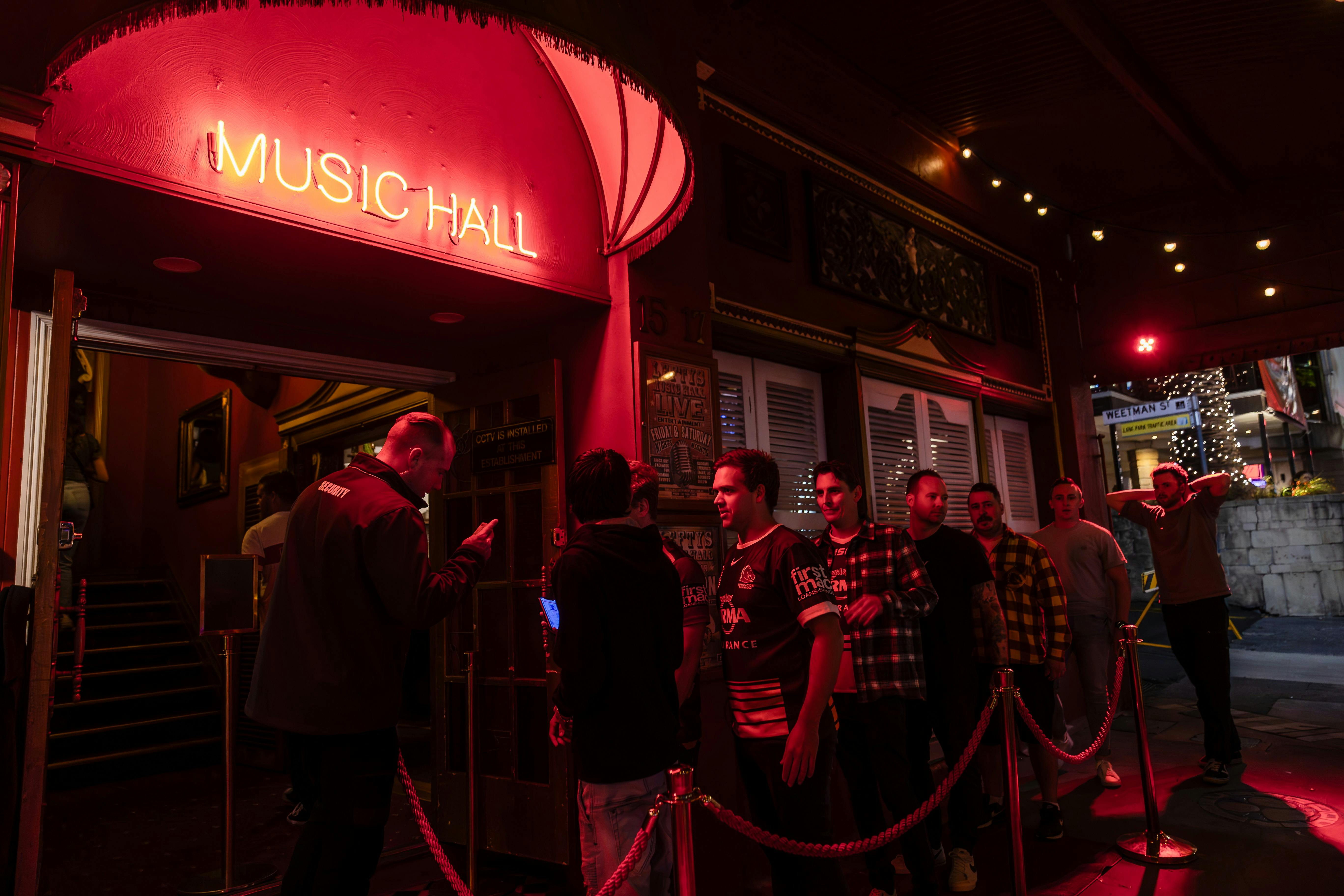 Outside shot of Lefty's Music Hall with people lining up to get in.