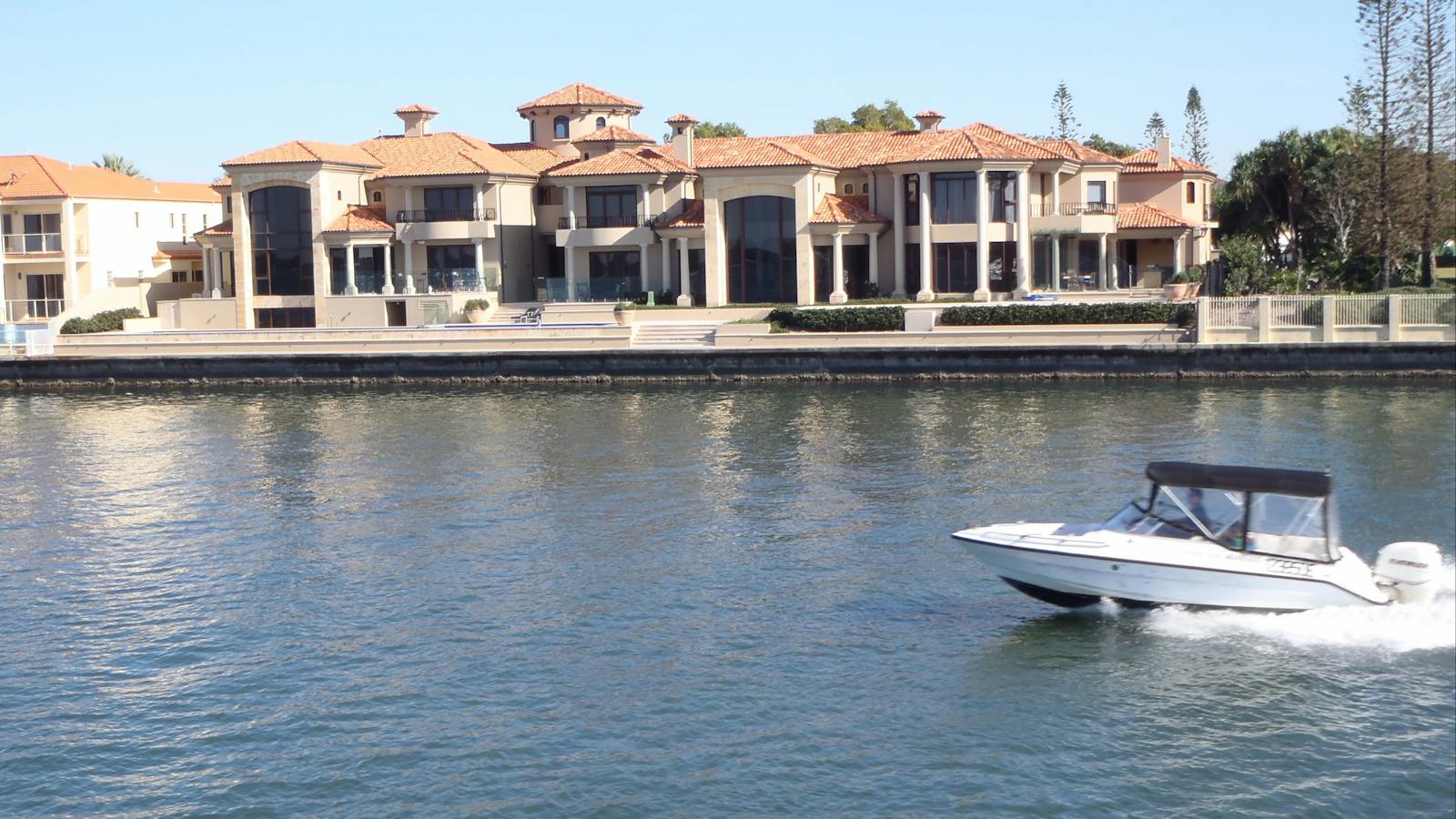 Lady Brisbane sailing past mansions at the Gold Coast