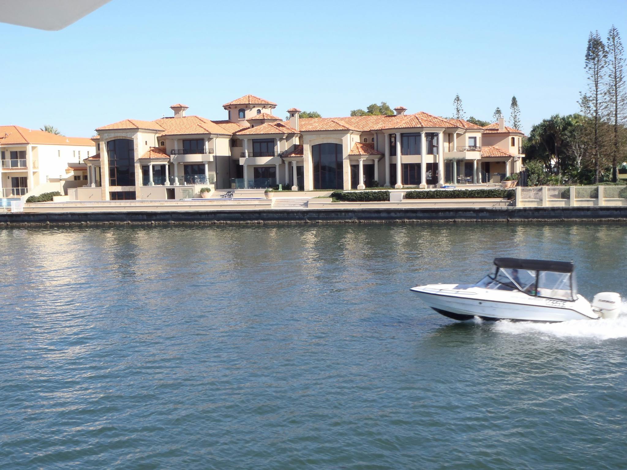 Lady Brisbane sailing past mansions at the Gold Coast
