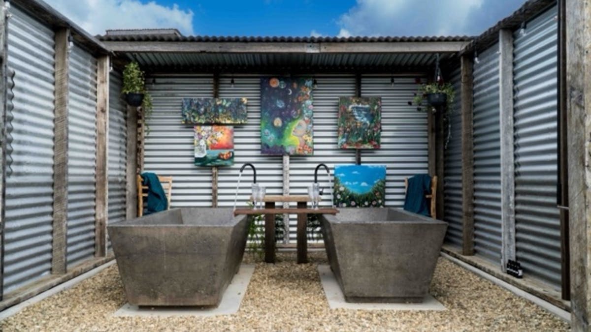 Each Bathhouse is constructed from recycled materials and features 2 handcrafted-bathtubs