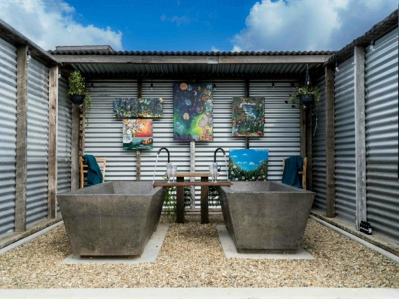Each Bathhouse is constructed from recycled materials and features 2 handcrafted-bathtubs Each Bathhouse is constructed from recycled materials and features 2 handcrafted-bathtubs