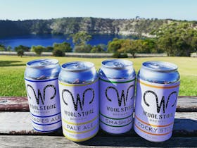 Cans of beer in front of Blue Lake