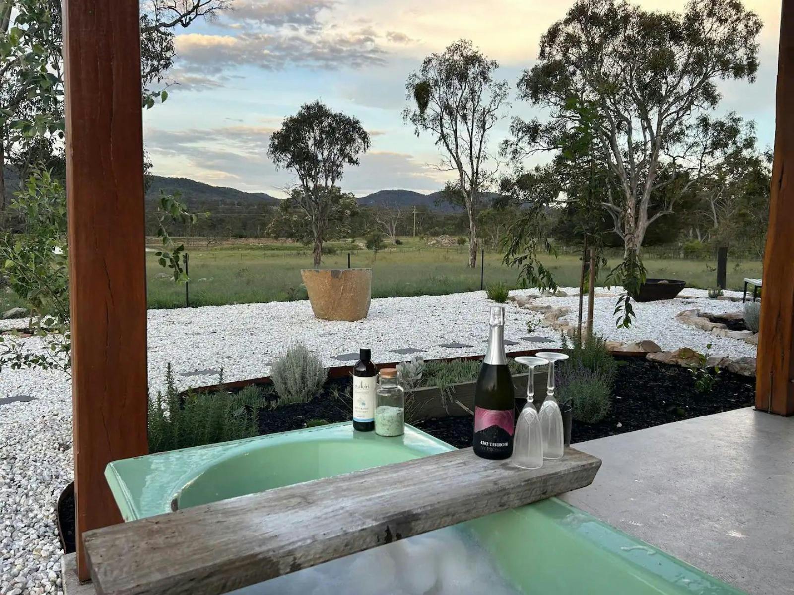 View of backyard from bathtub