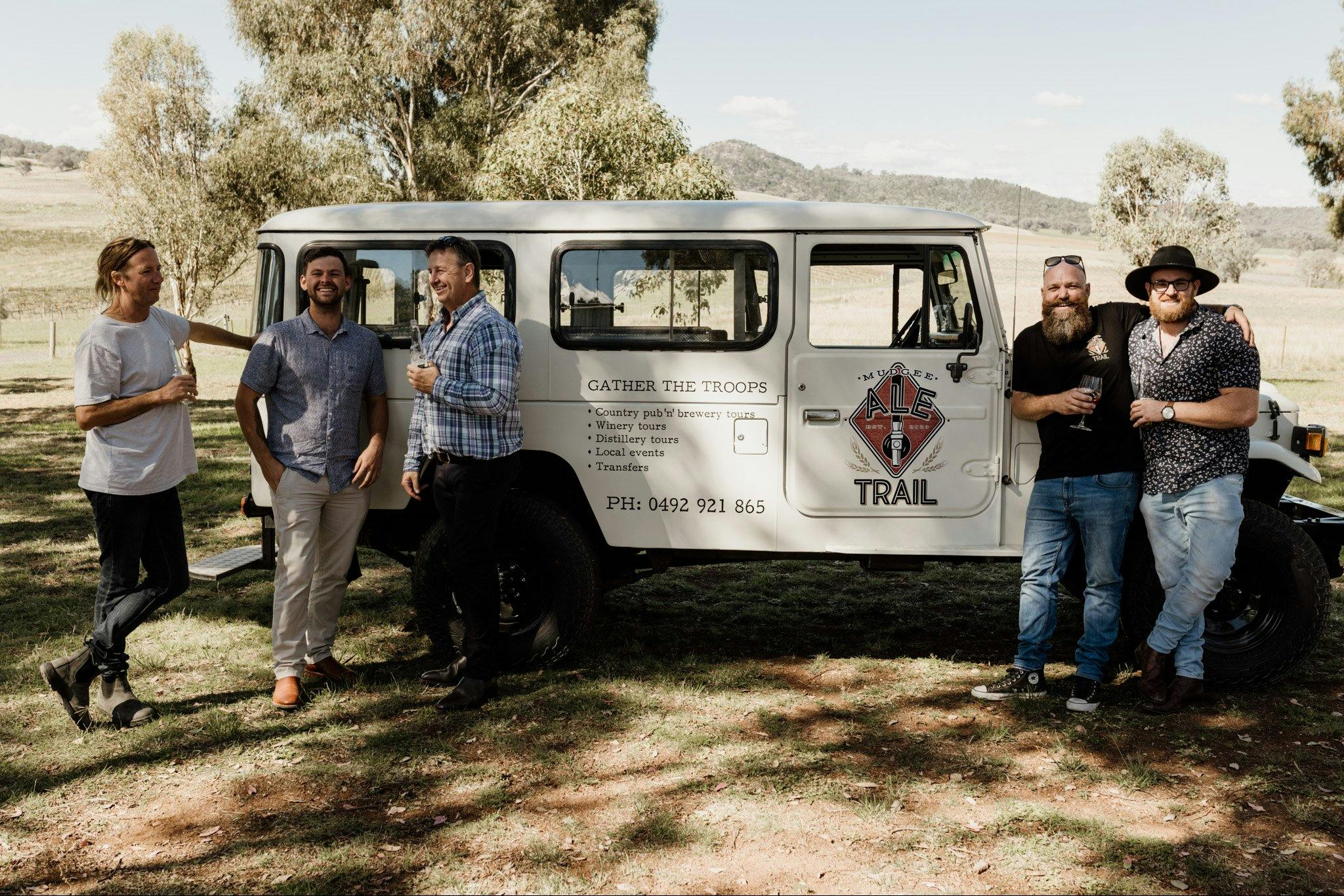Mudgee Ale Trail clients at a local winery posing with Troopy