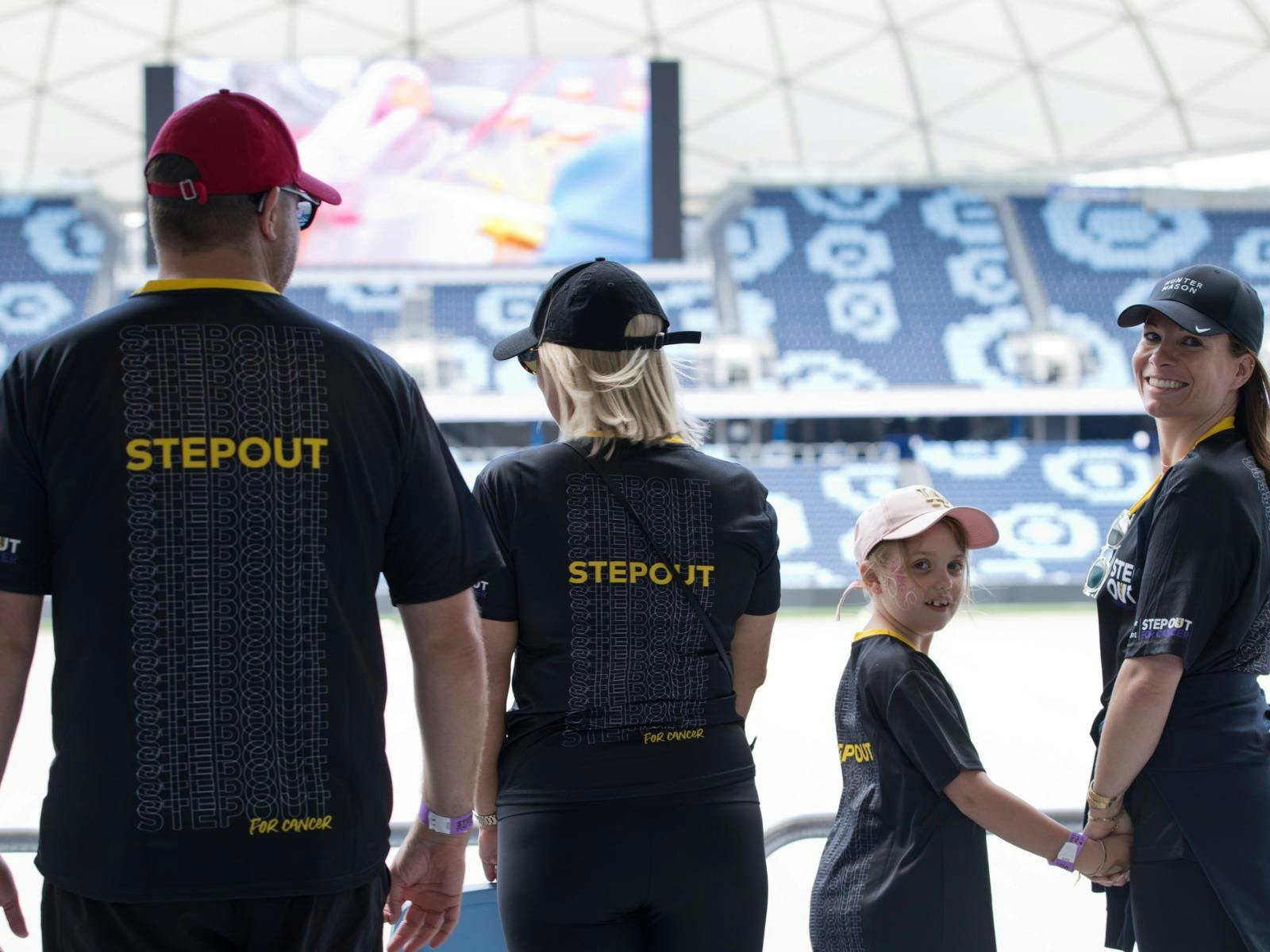 Family photo in Allianz Stadium at Step Out for Cancer