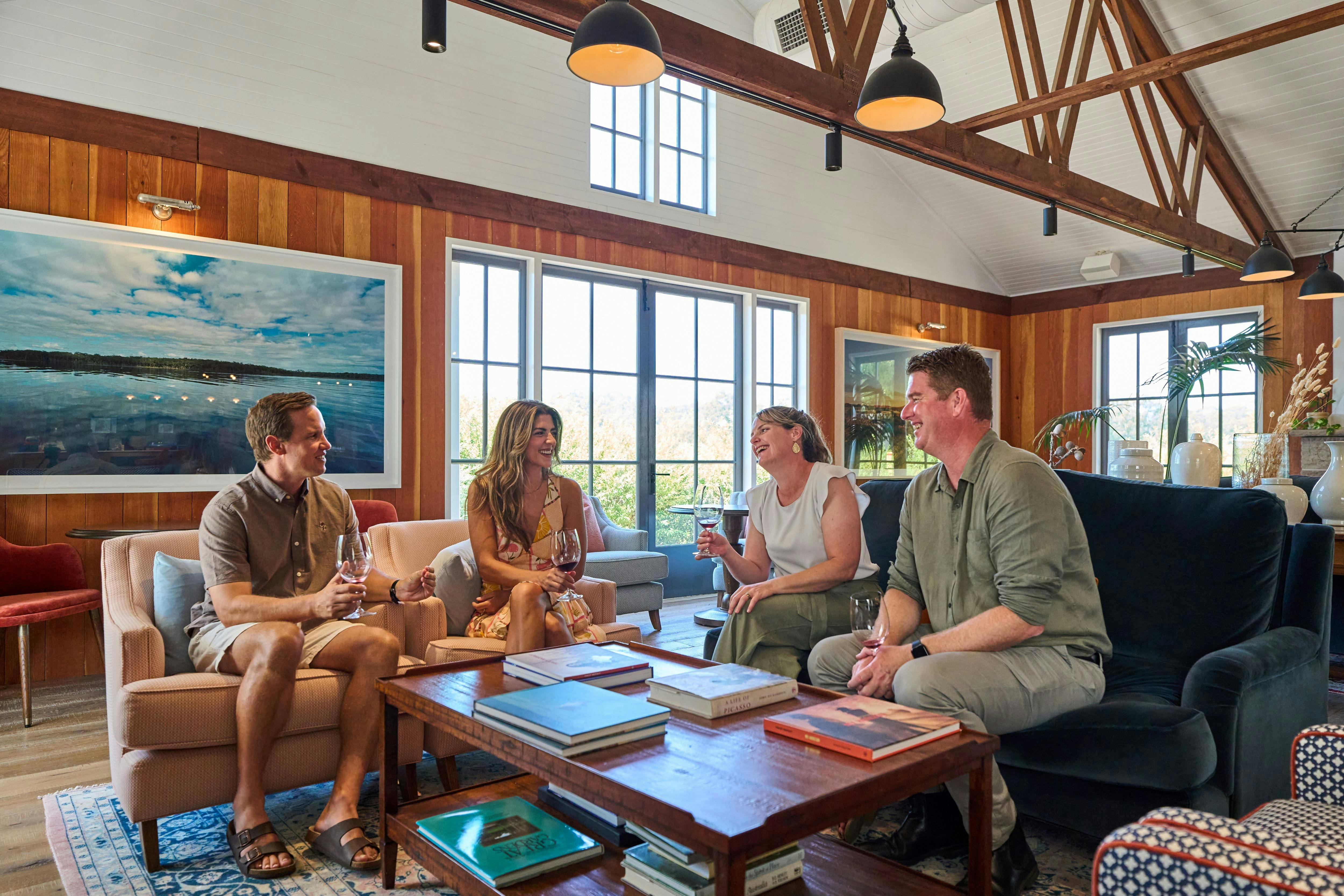 Guests sitting in The Barn viewing art work