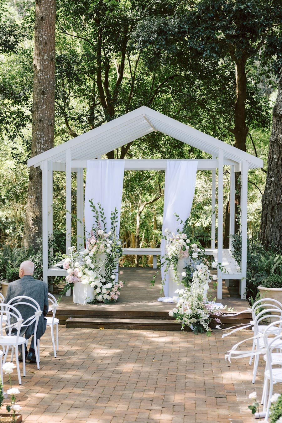 photo of the tree cathedral with florals and drapery