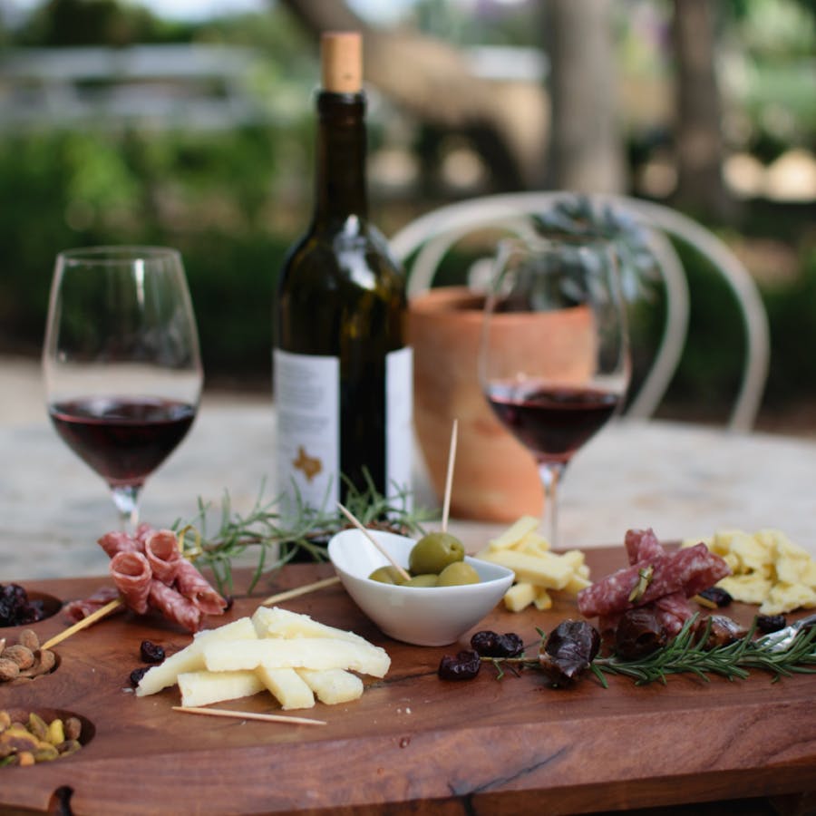 Wine and cheese placed on a table to enjoy