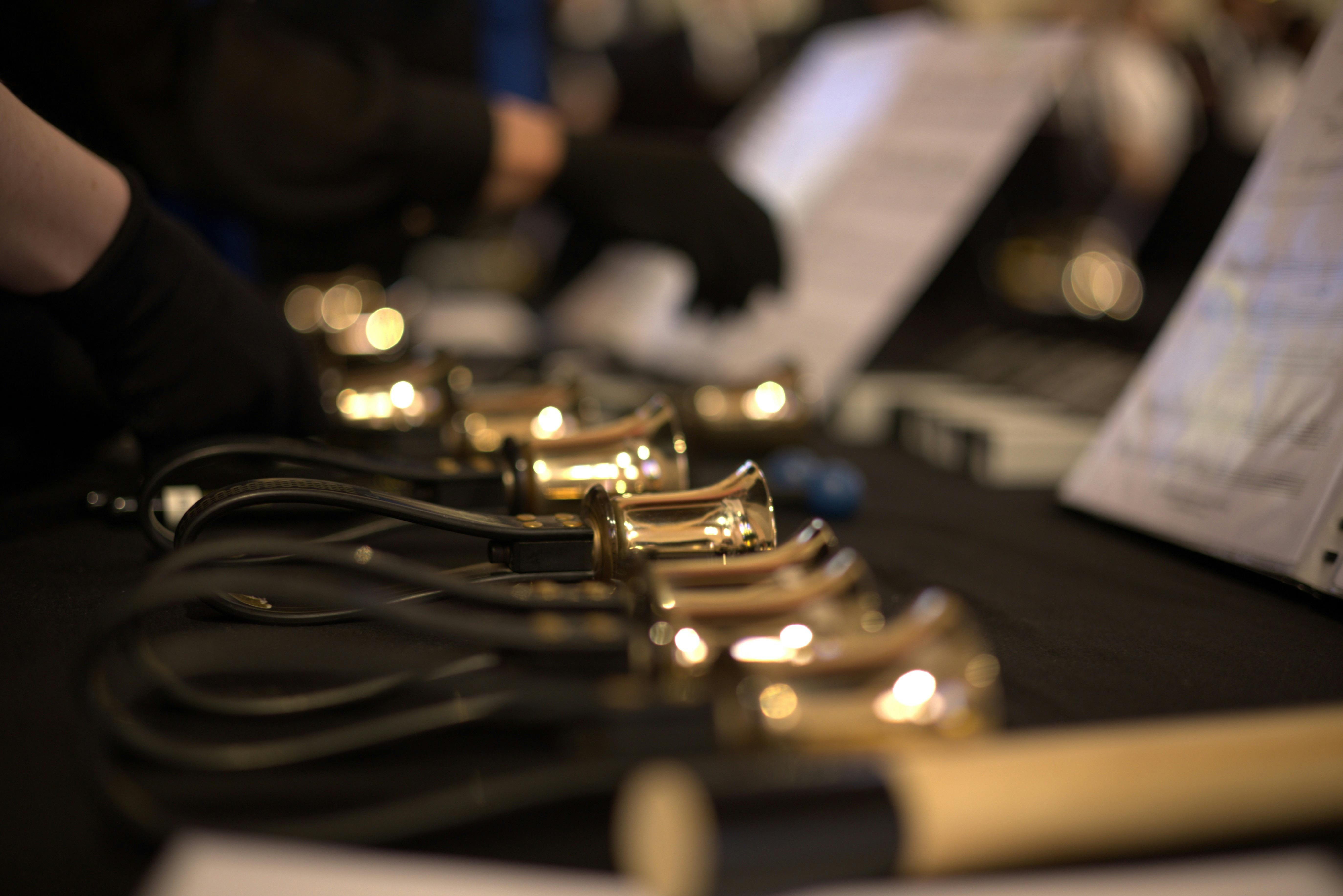 Toowoombells Handbell Choir with bells on table and sheet music