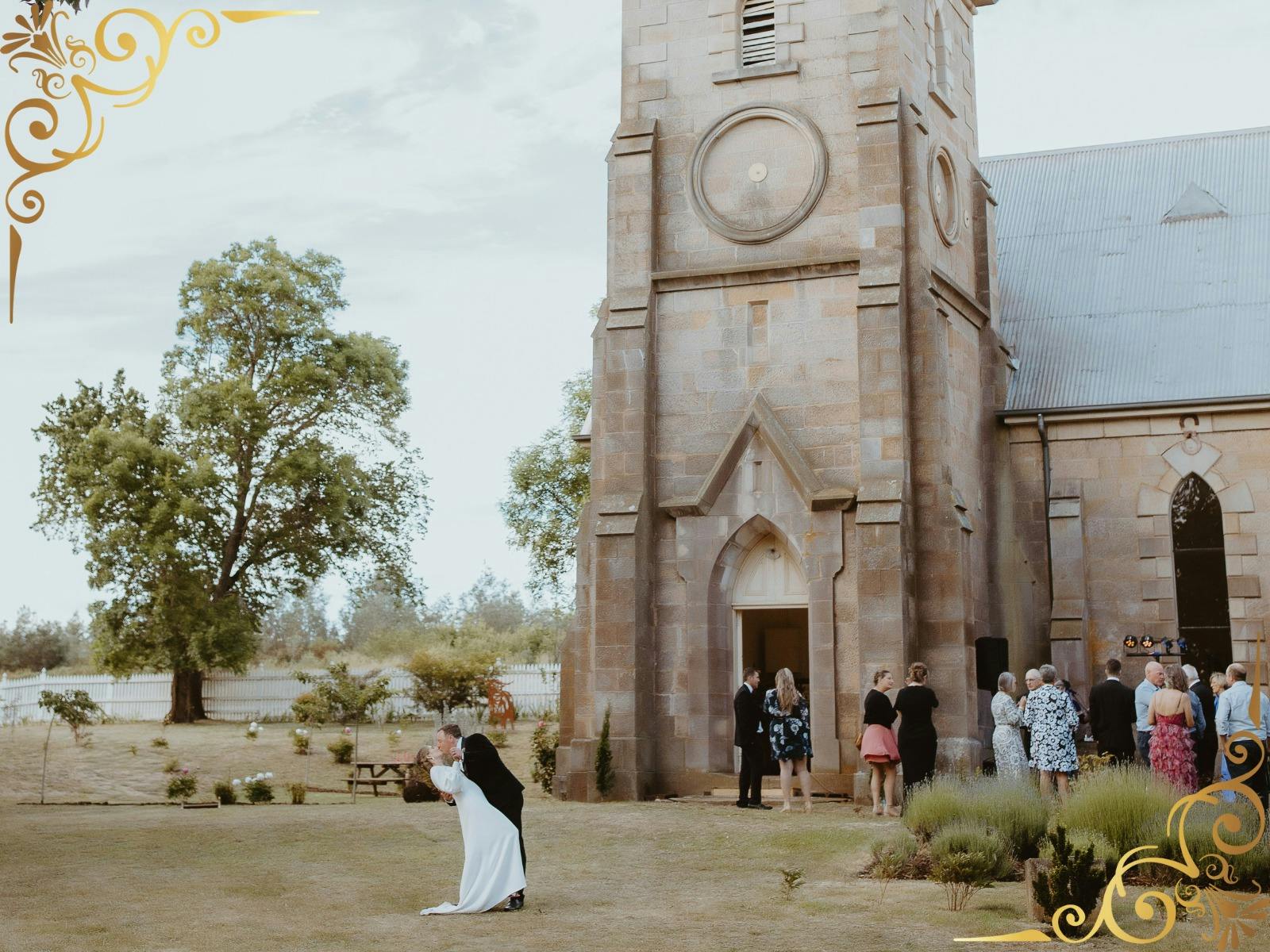 Heart of Tasmania Wedding Expo Campbell Town showing wedding couple in front of The Church