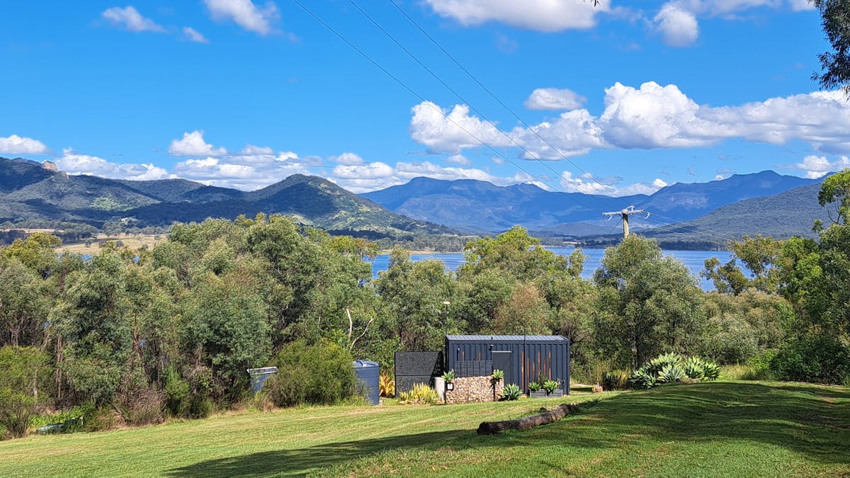 view over gardens to lake and mountain range beyond