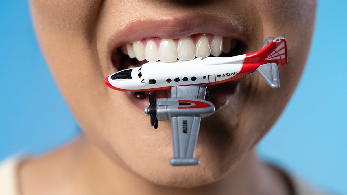Women with a Plane in her Teeth