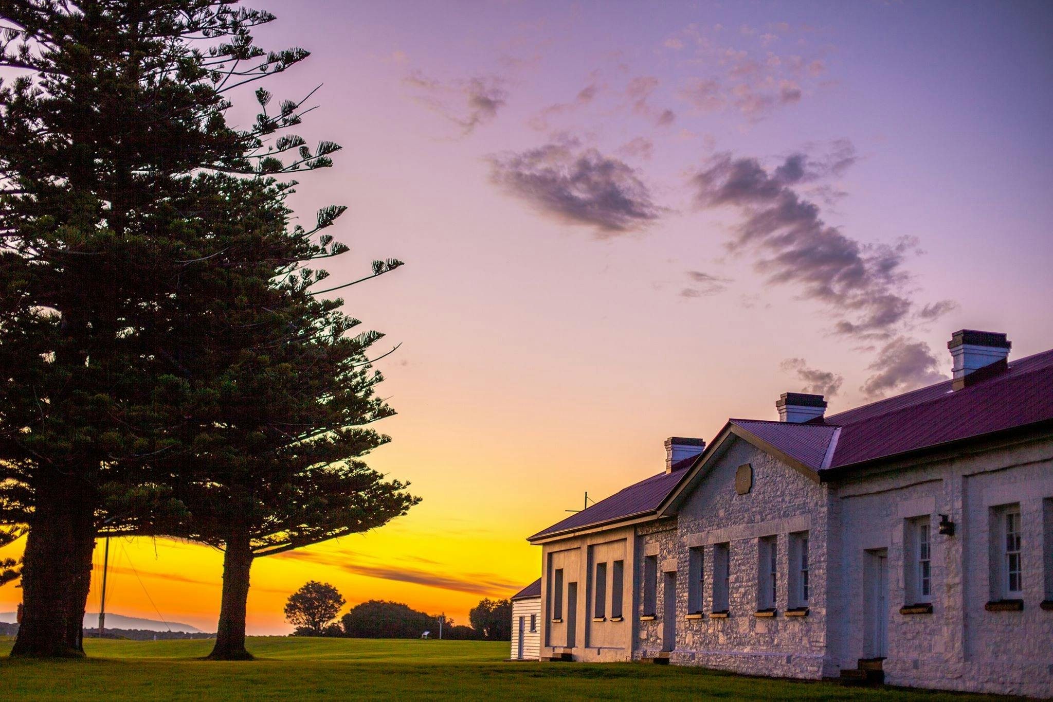 The Low Head sunsets over the water with norfolk island pines