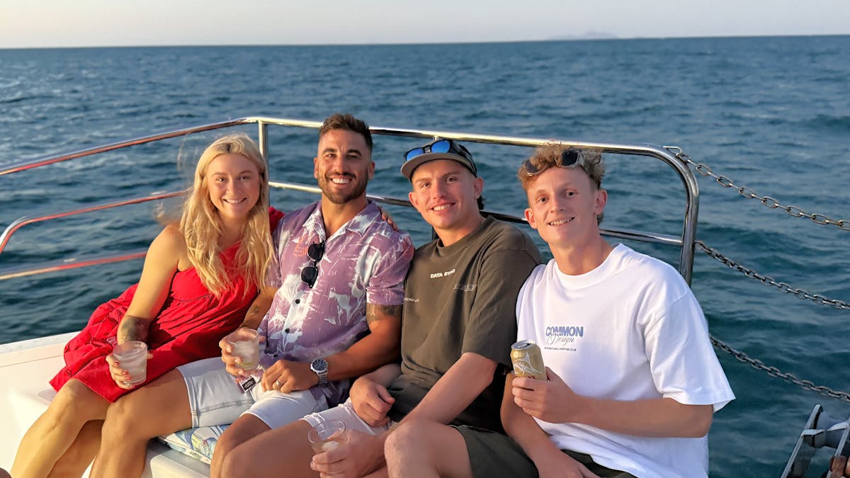 4 guests enjoying the sunset on front deck