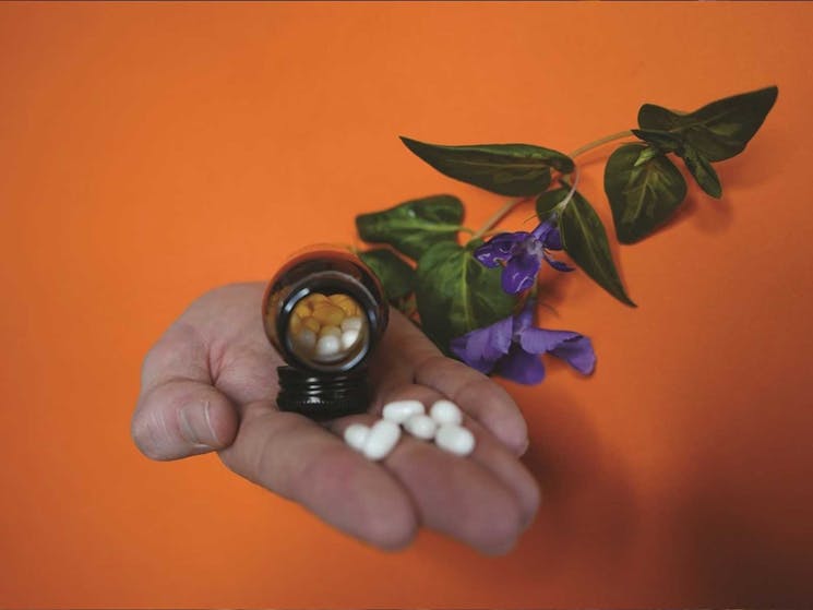 Image of a hand holding pills