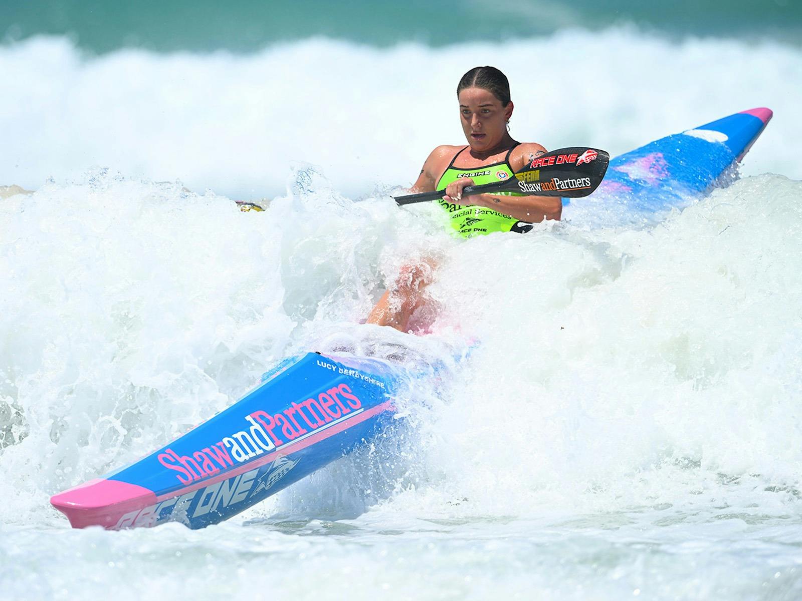 Past champion Lucy Derbyshire keeps control of her craft over a breaking wave