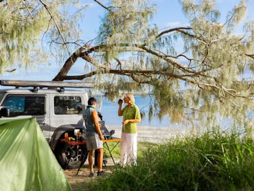 Campers having breakfast at Pelican Bay Camping Area Campers having breakfast at Pelican Bay Camping Area