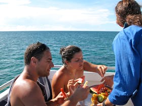 Enjoying fresh fruit platter on cruise home on Ocean Freedom
