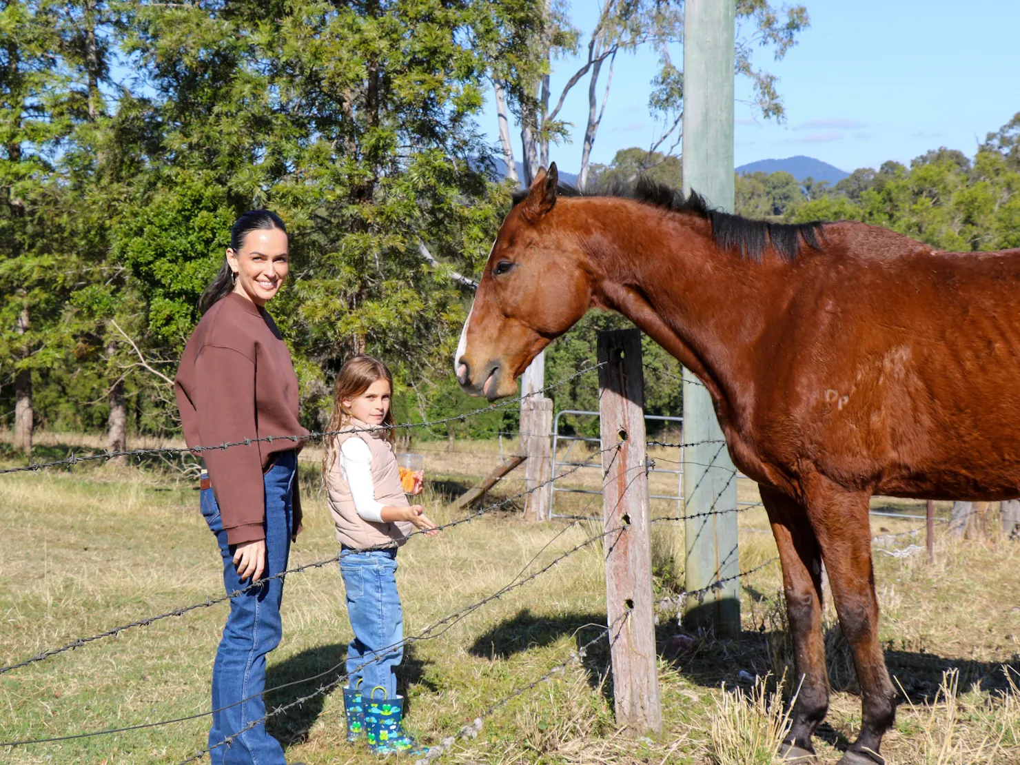 Mother and daughter with horse