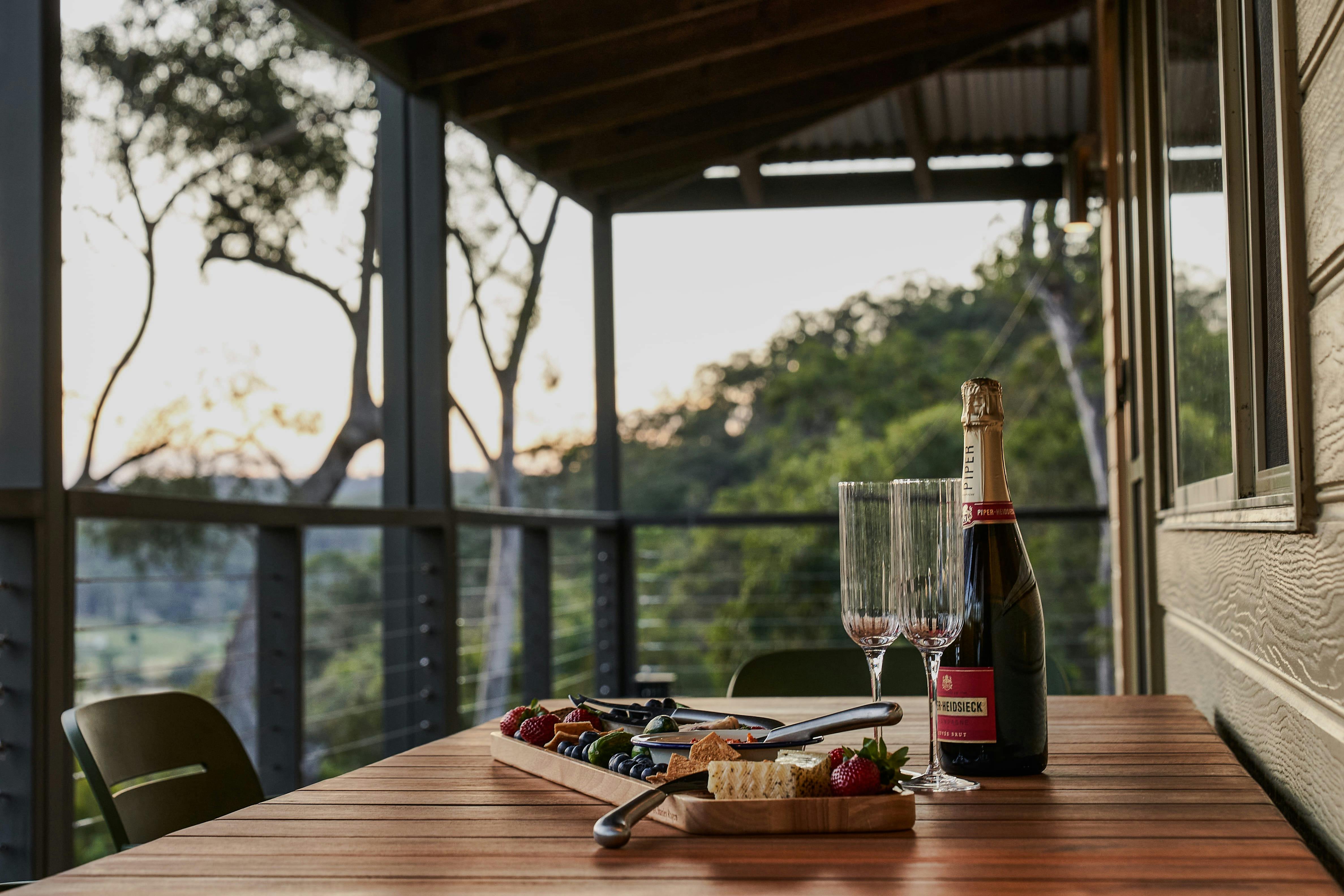 Table setting on verandah showing valley and river views