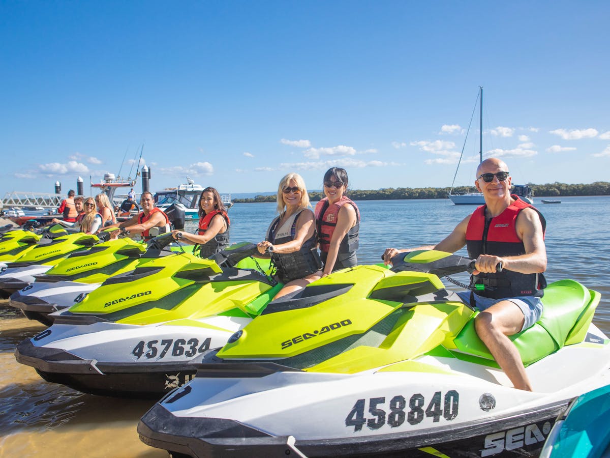 Group of people on jet skis Group of people on jet skis