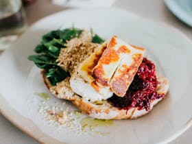 Poached eggs, grilled halloumi, beetroot relish, baby spinach, hazelnut dukkah,  toasted sourdough
