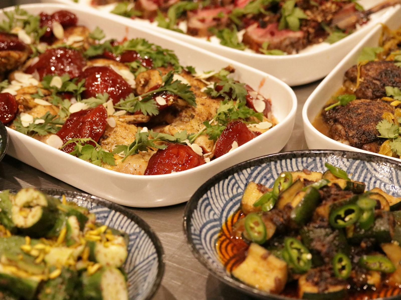 A variety of dishes including fried quail with quince, rack of lamb and braised chicken