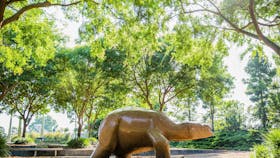marble sculptue of creature in an outdoor garden