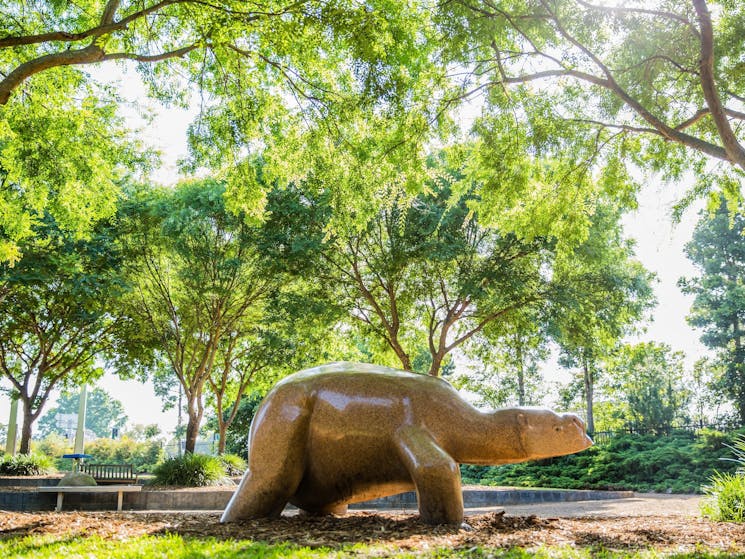 marble sculptue of creature in an outdoor garden