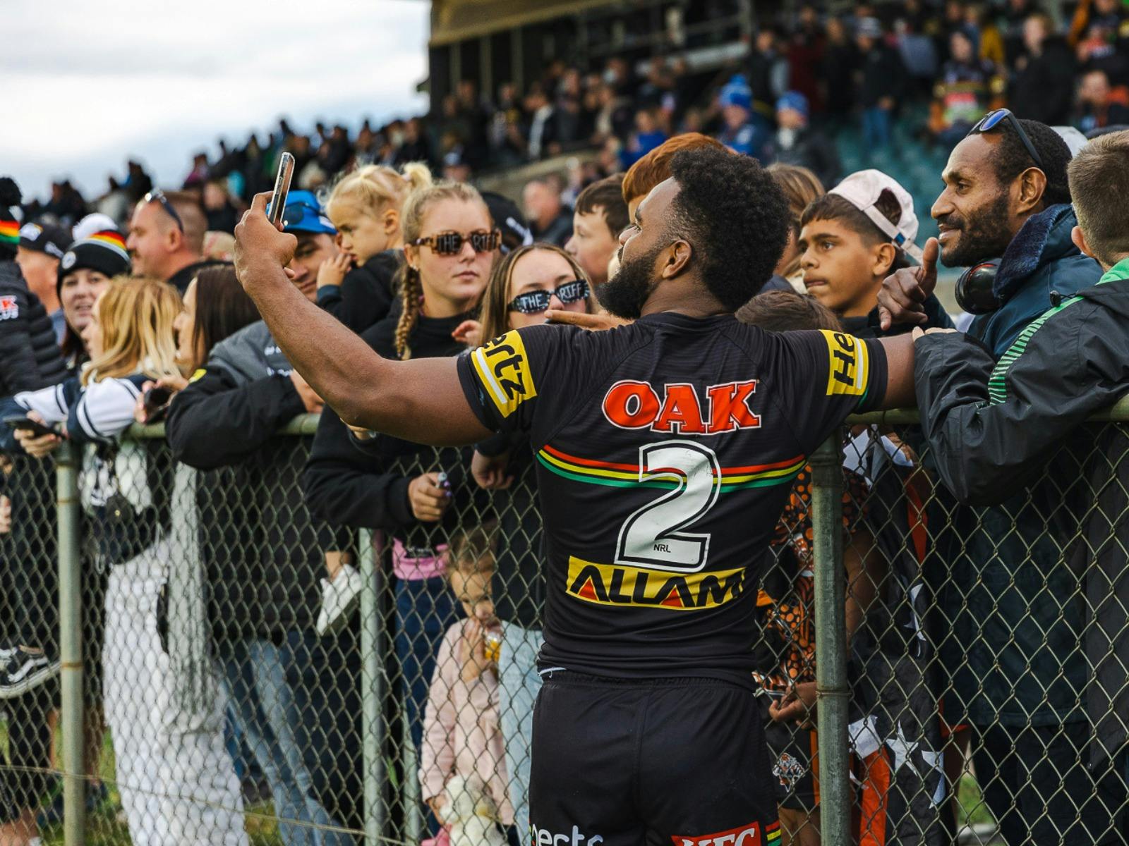 Fans getting a selfie with Panthers player after the game..