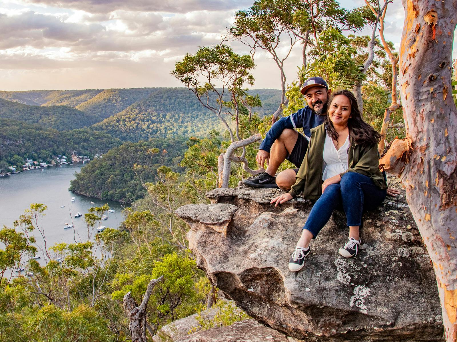 Couple sitting near cliff