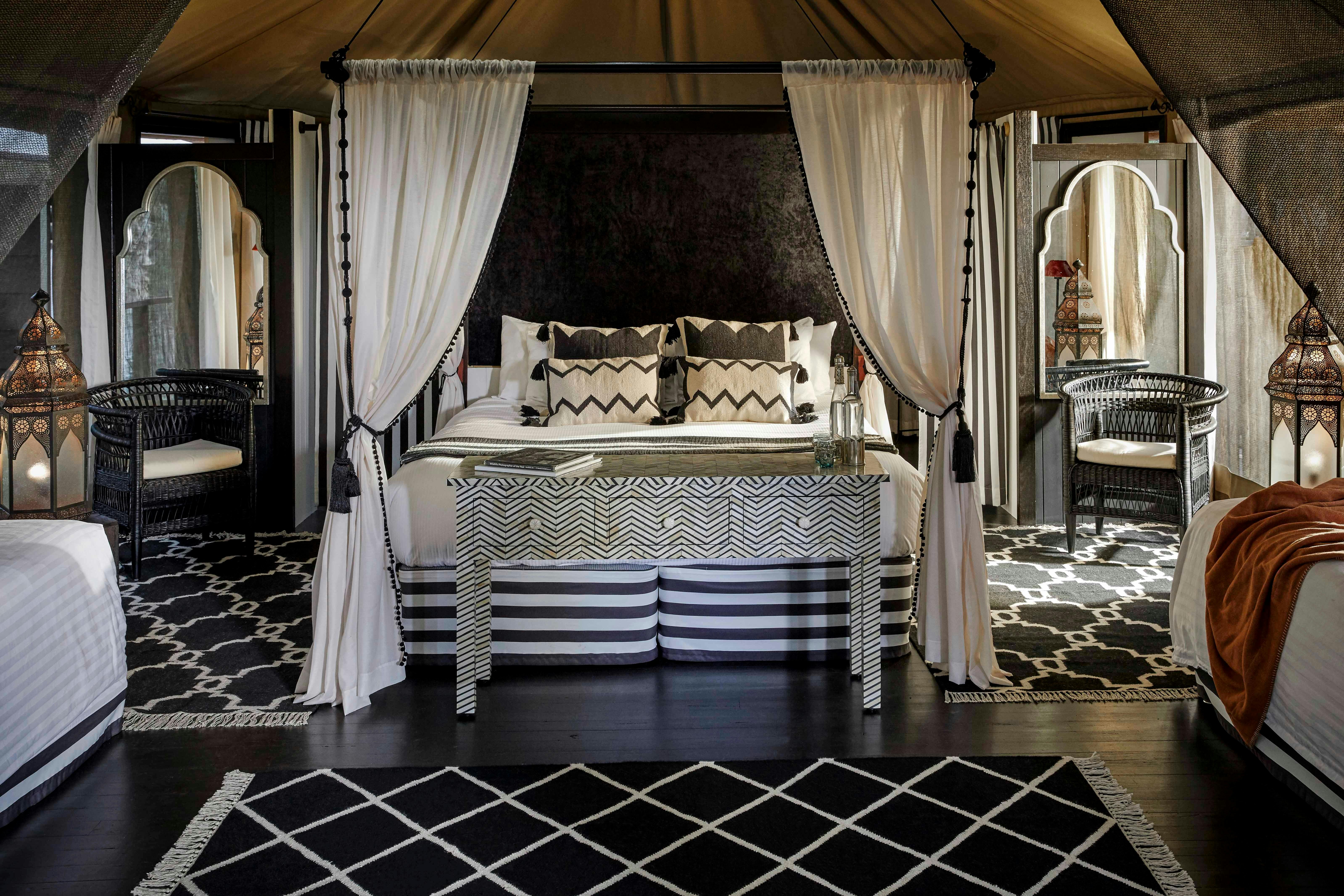 Moroccan inspired black and white interior of the King Deluxe safari tent at Paperbark Camp