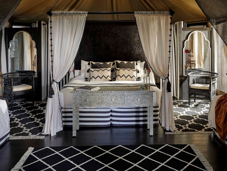 Moroccan inspired black and white interior of the King Deluxe safari tent at Paperbark Camp