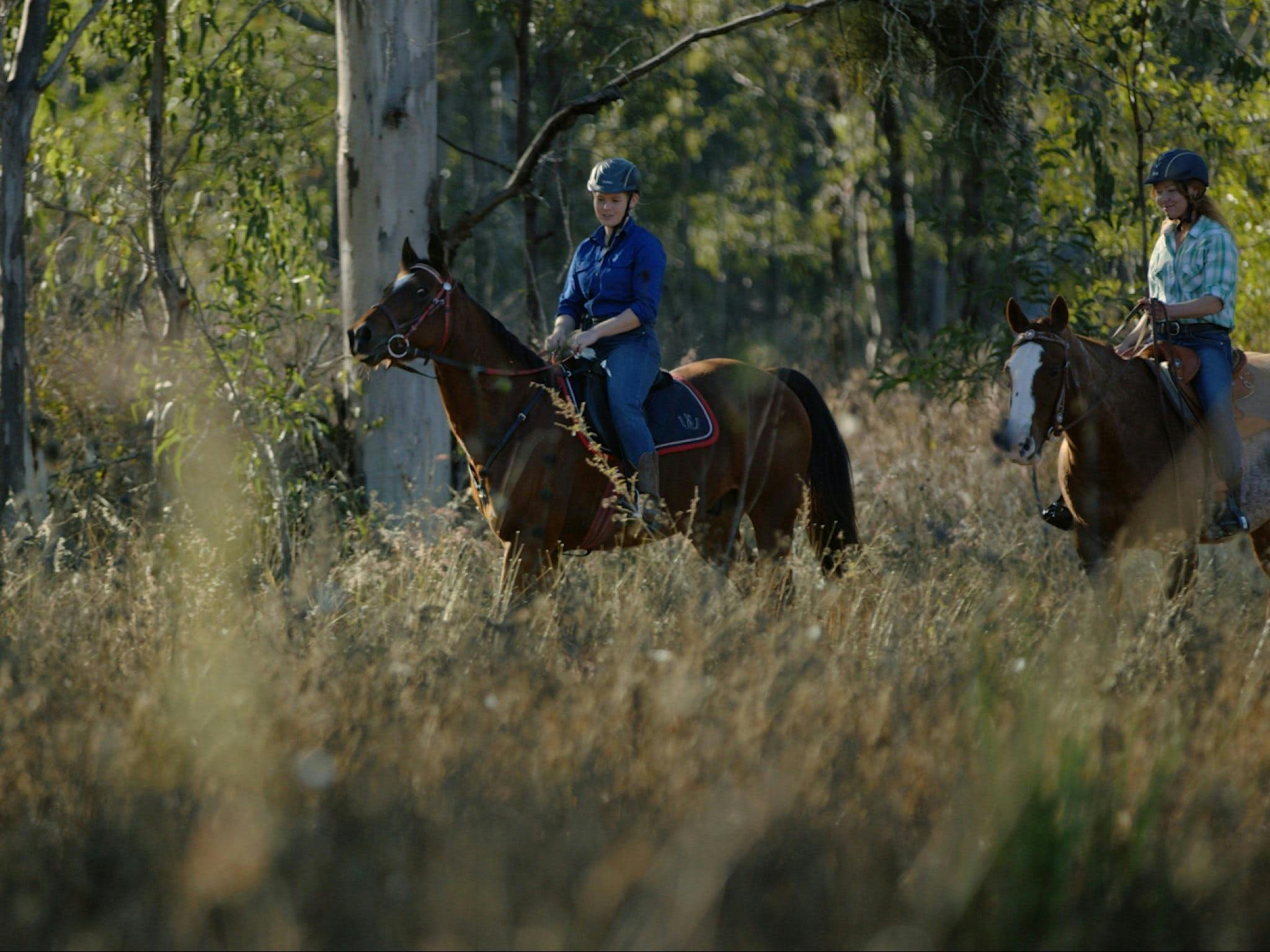 Two women riding horses Two women riding horses