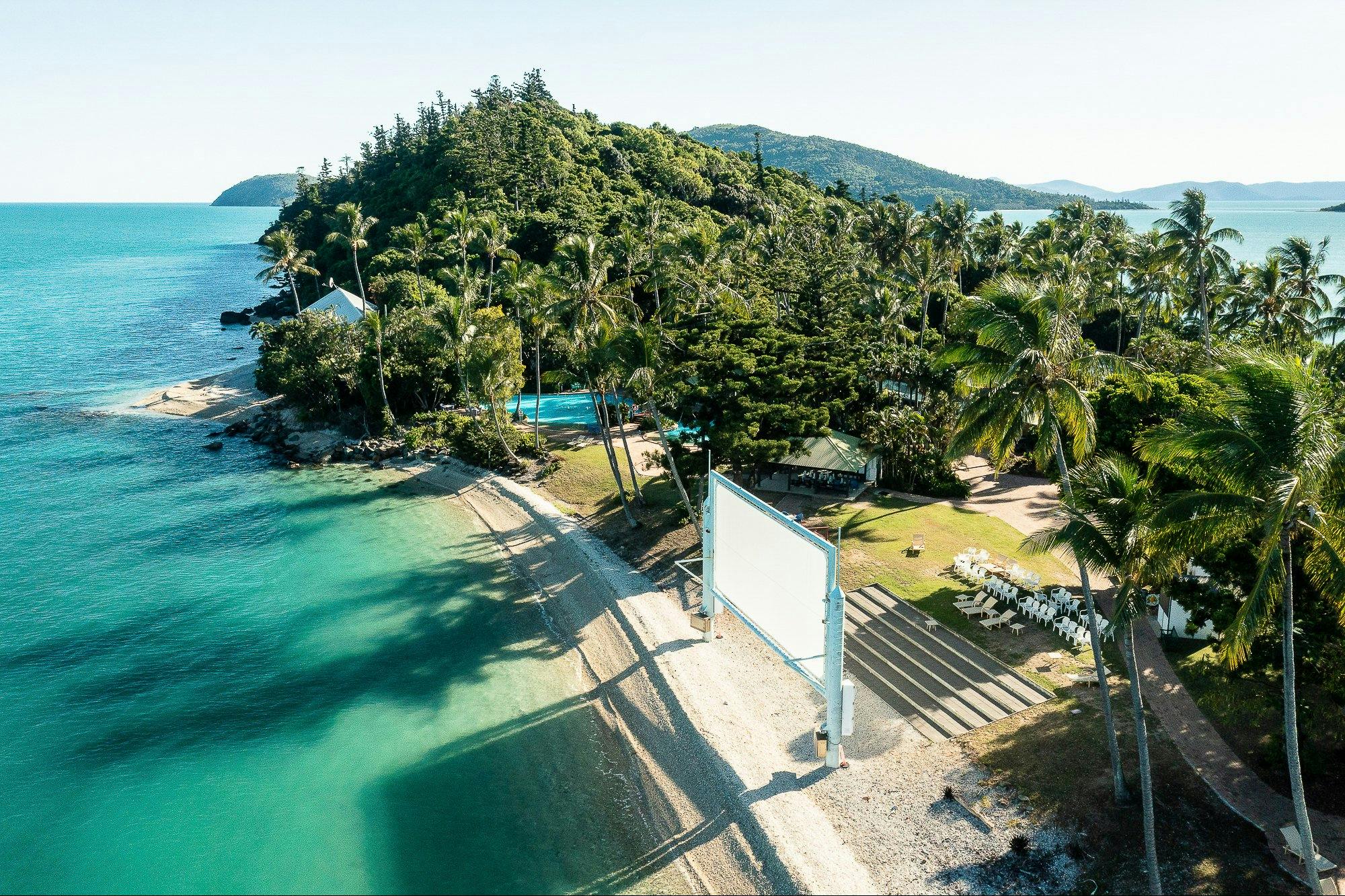 Aerial view of Daydream Island's southern end, featuring outdoor movie screen and entertainment area