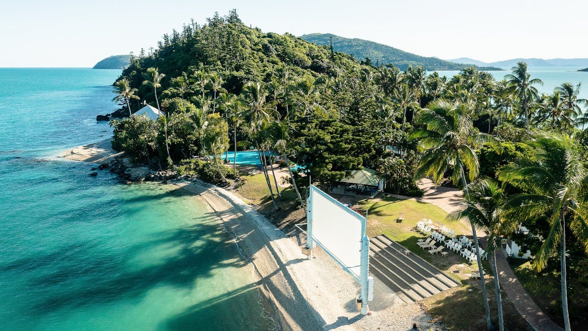 Aerial view of Daydream Island's southern end, featuring outdoor movie screen and entertainment area
