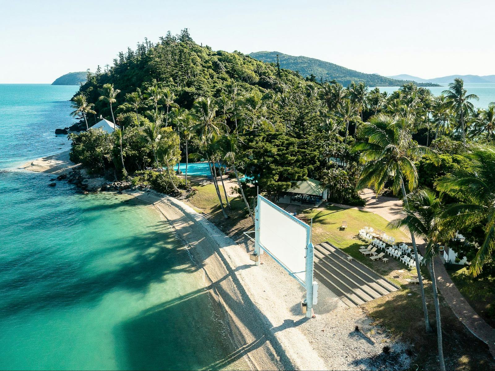 Aerial view of Daydream Island's southern end, featuring outdoor movie screen and entertainment area