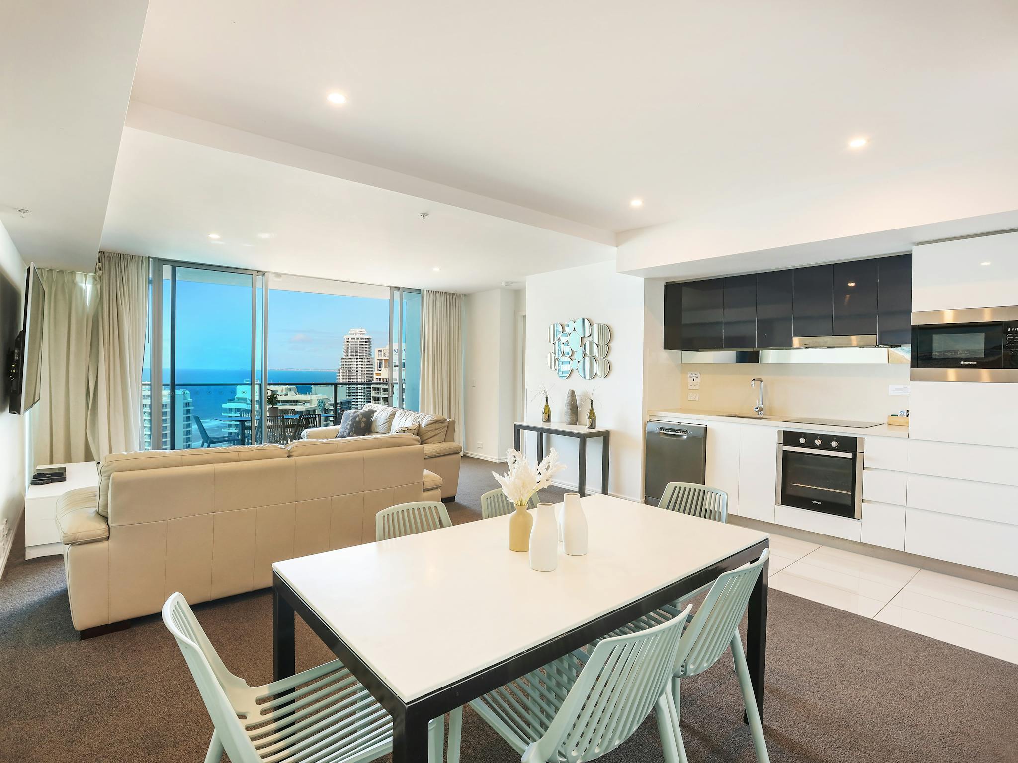 Open plan living - dining, kitchen, lounge room - Hilton Surfers Paradise - Gold Coast Holidays Open plan living - dining, kitchen, lounge room - Hilton Surfers Paradise - Gold Coast Holidays