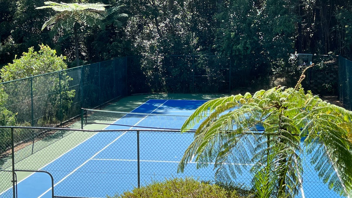 Gardens surrounding the tennis court can be enjoyed from the shaded gazebo / bbq table.