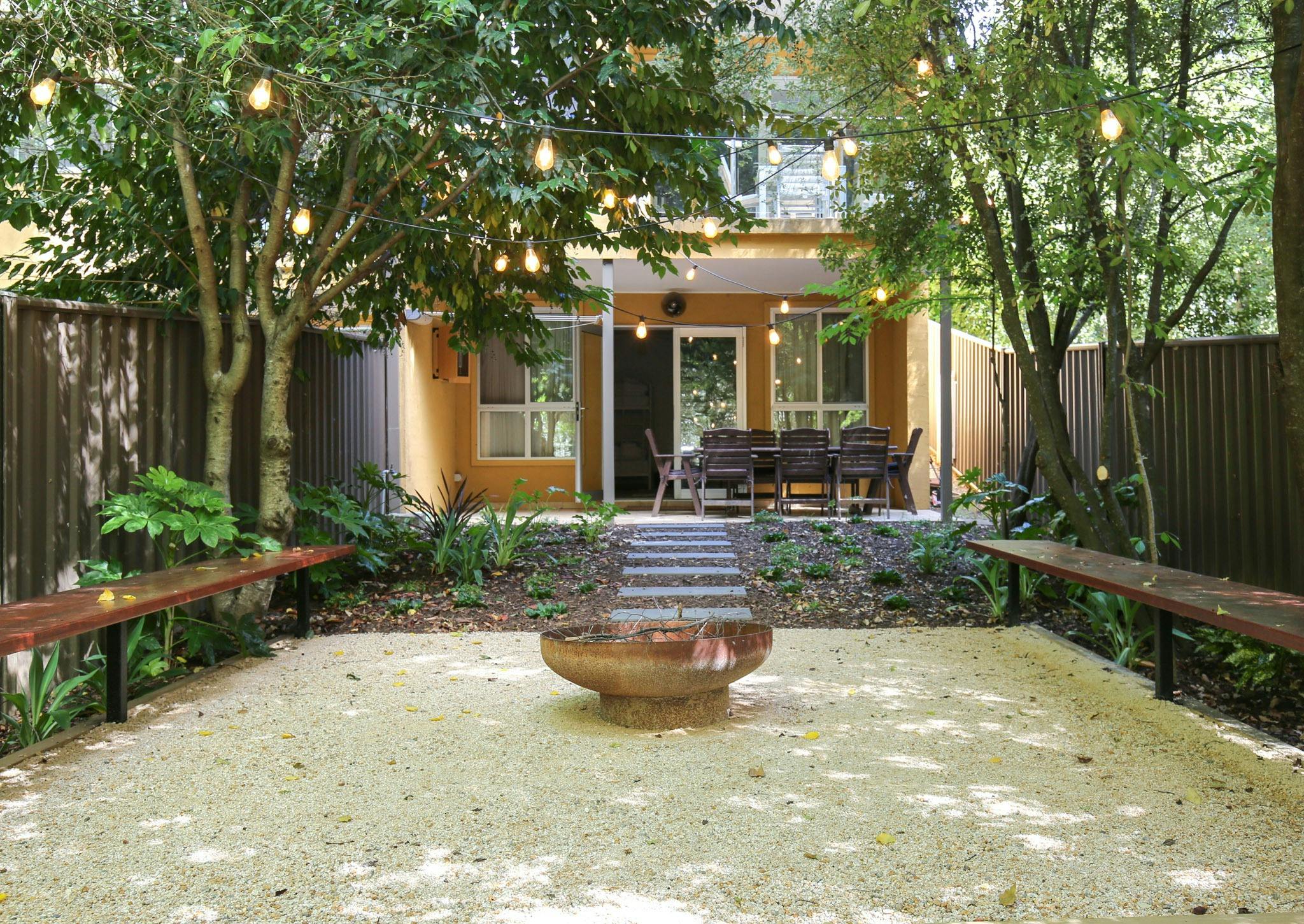 Backyard with fire pit at The Outta Towner with Alpine Valley Getaways