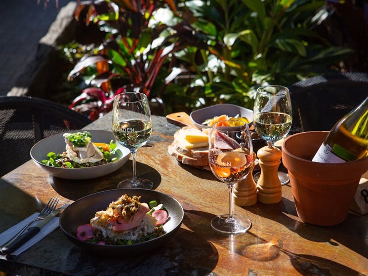 Sunny Outdoor Table with wine and food