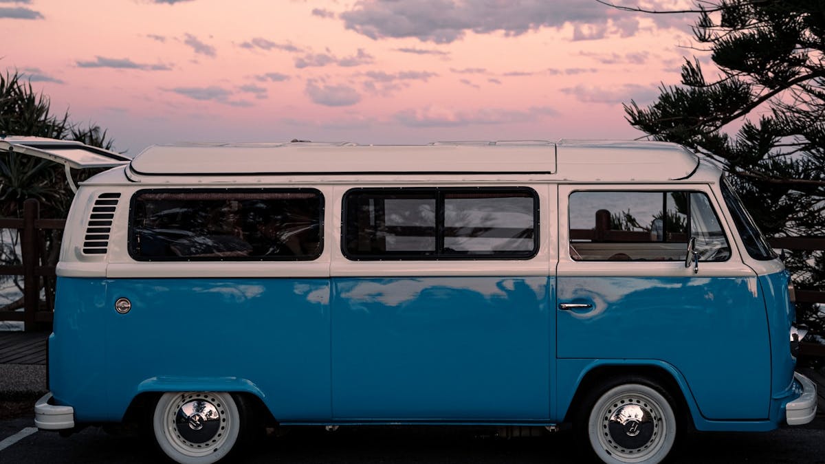 Blue vintage kombi in the sunset
