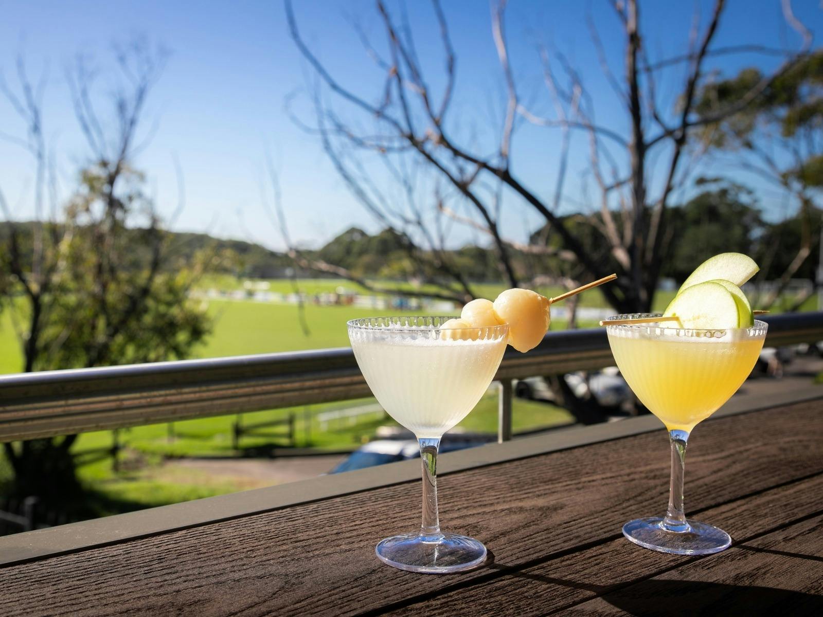 Cocktails on the balcony at Tradies Helensburgh